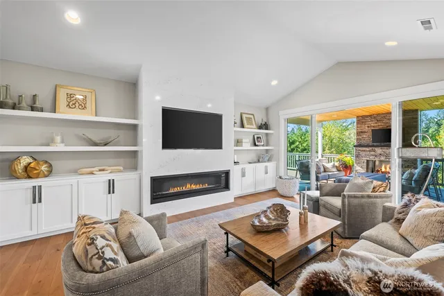 a living room with furniture fireplace and a flat screen tv