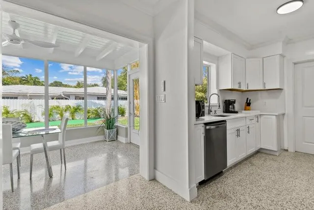 a kitchen that has a lot of cabinets in it