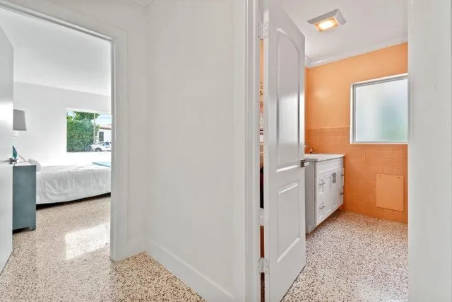 a view of a bathroom with sink and mirror