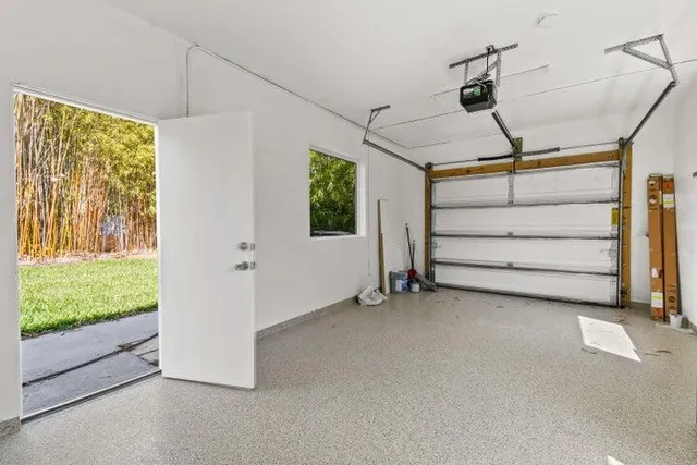 a view of room with wooden floor and a window