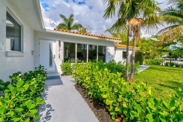 front view of a house with a yard