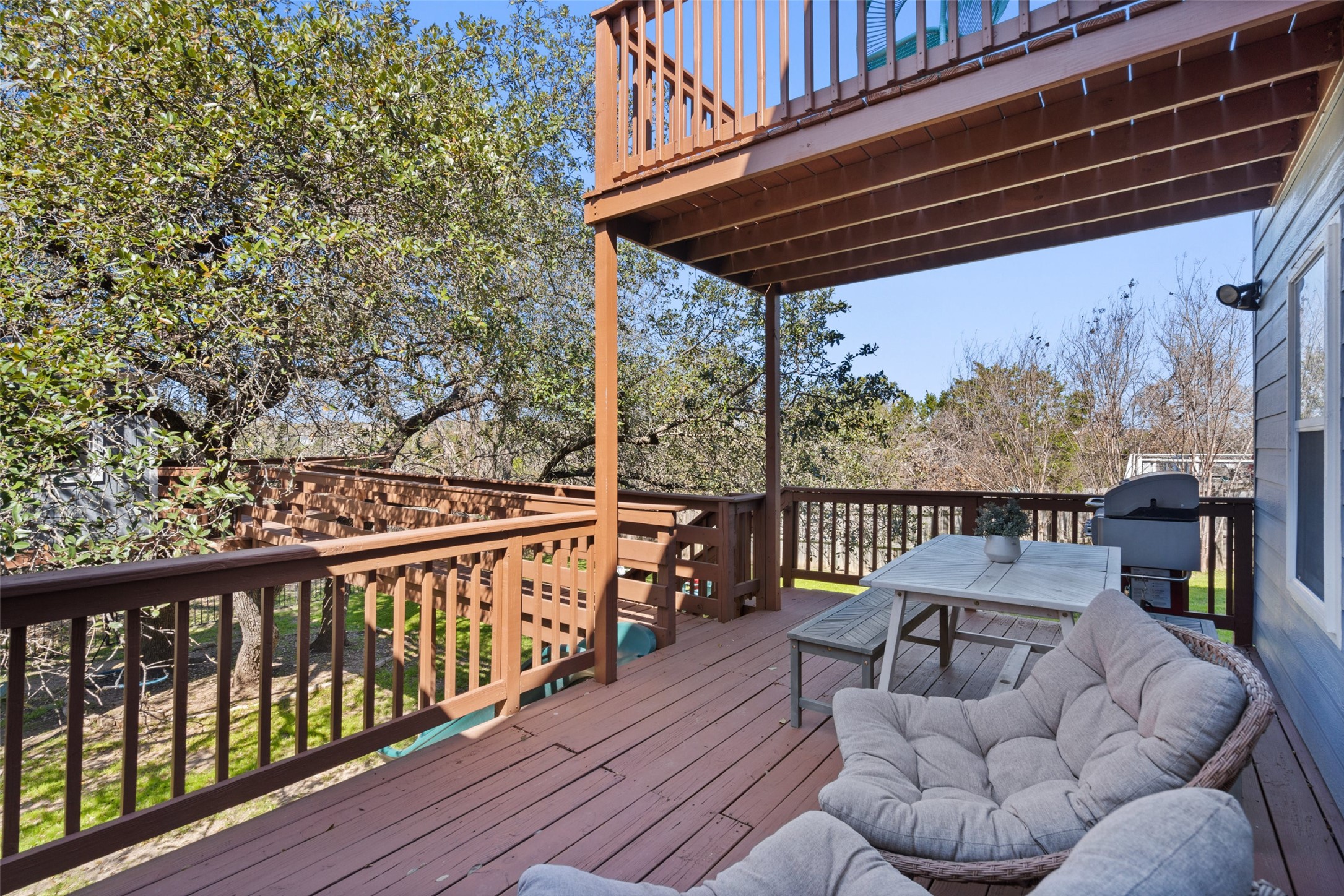 2012 Indian Creek Road Austin, TX 78734 - Photo 24 of 28 a view of balcony with wooden floor and outdoor seating