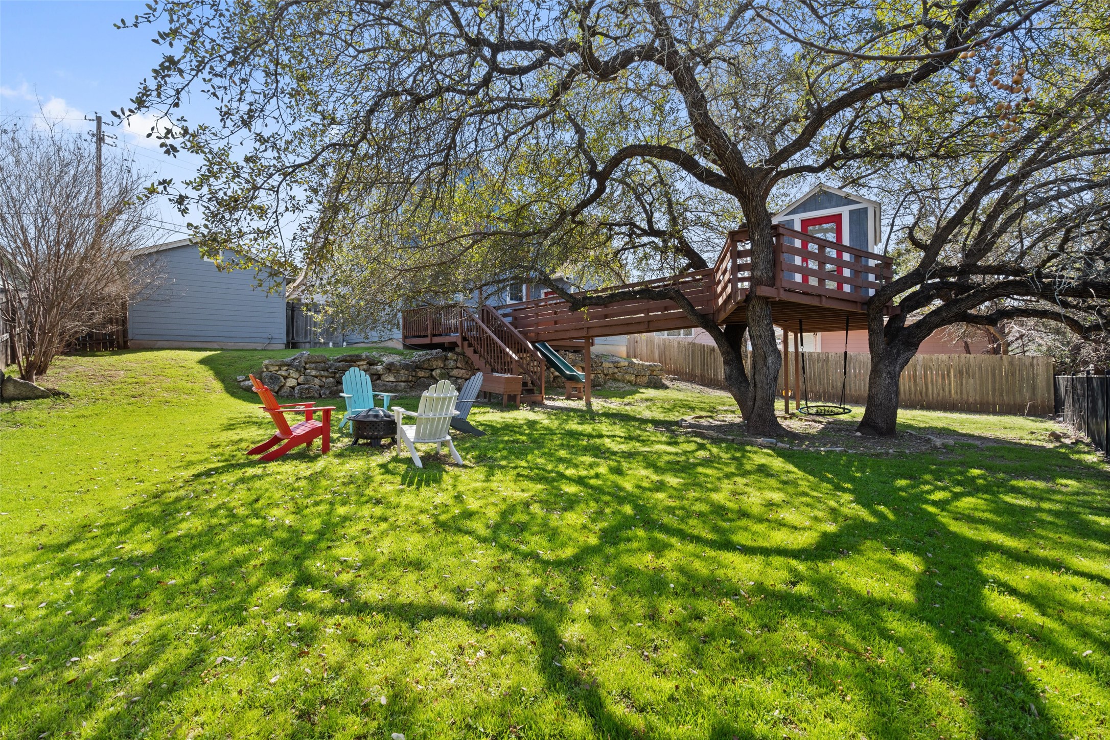 2012 Indian Creek Road Austin, TX 78734 - Photo 27 of 28 a backyard of a house with table and chairs