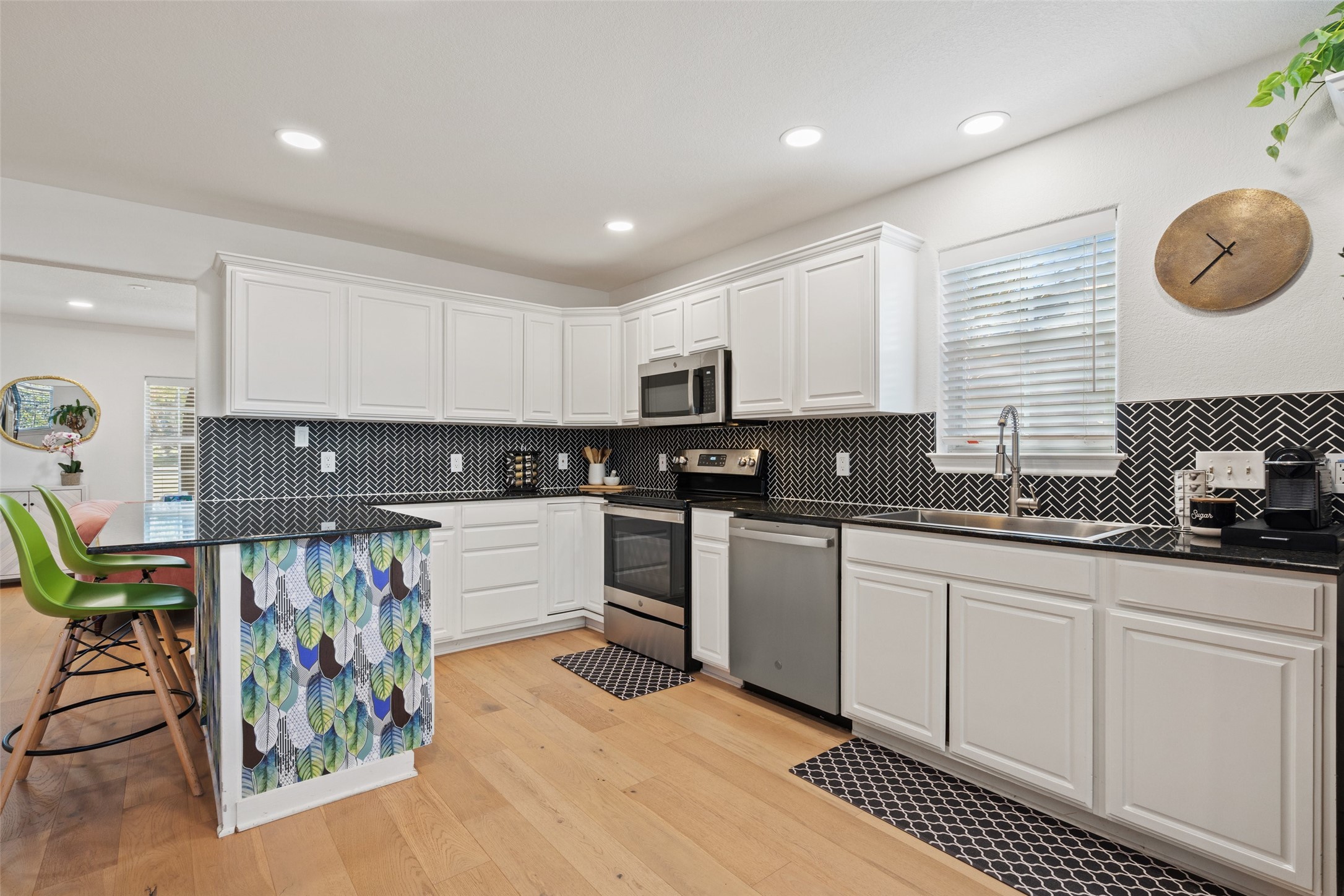 2012 Indian Creek Road Austin, TX 78734 - Photo 8 of 28 a kitchen with stainless steel appliances granite countertop a sink and cabinets