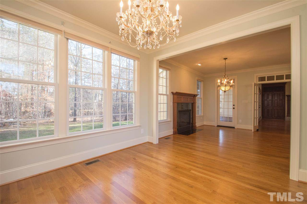 1068 Tacketts Pond Drive Raleigh, NC 27614 - Photo 18 of 25 Amazing gourmet kitchen with large center island, granite counters, stainless steel appliances, tons of cabinet and counter space. Also enjoy the perfect breakfast area with fireplace and cozy keeping room Keeping room