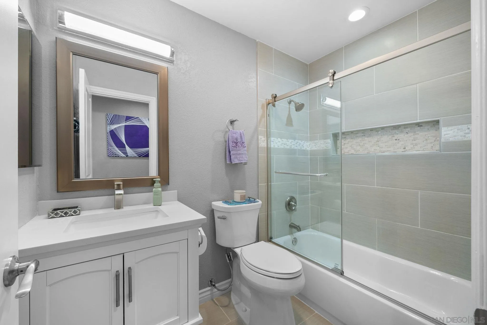 6503 Plaza Ridge Road San Diego, CA 92114 - Photo 13 of 37 a bathroom with a sink a toilet and shower