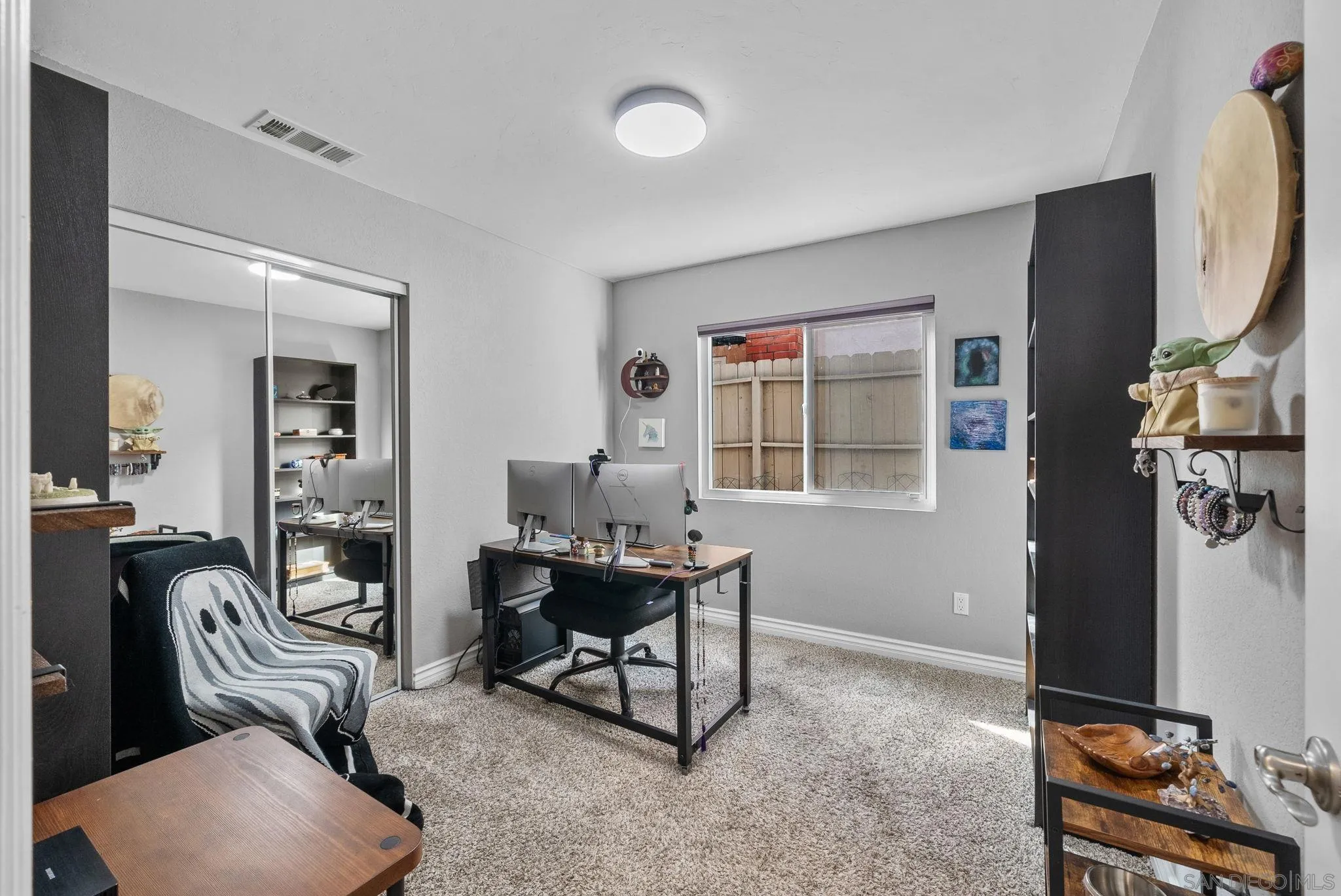 6503 Plaza Ridge Road San Diego, CA 92114 - Photo 14 of 37 a workspace with furniture and window