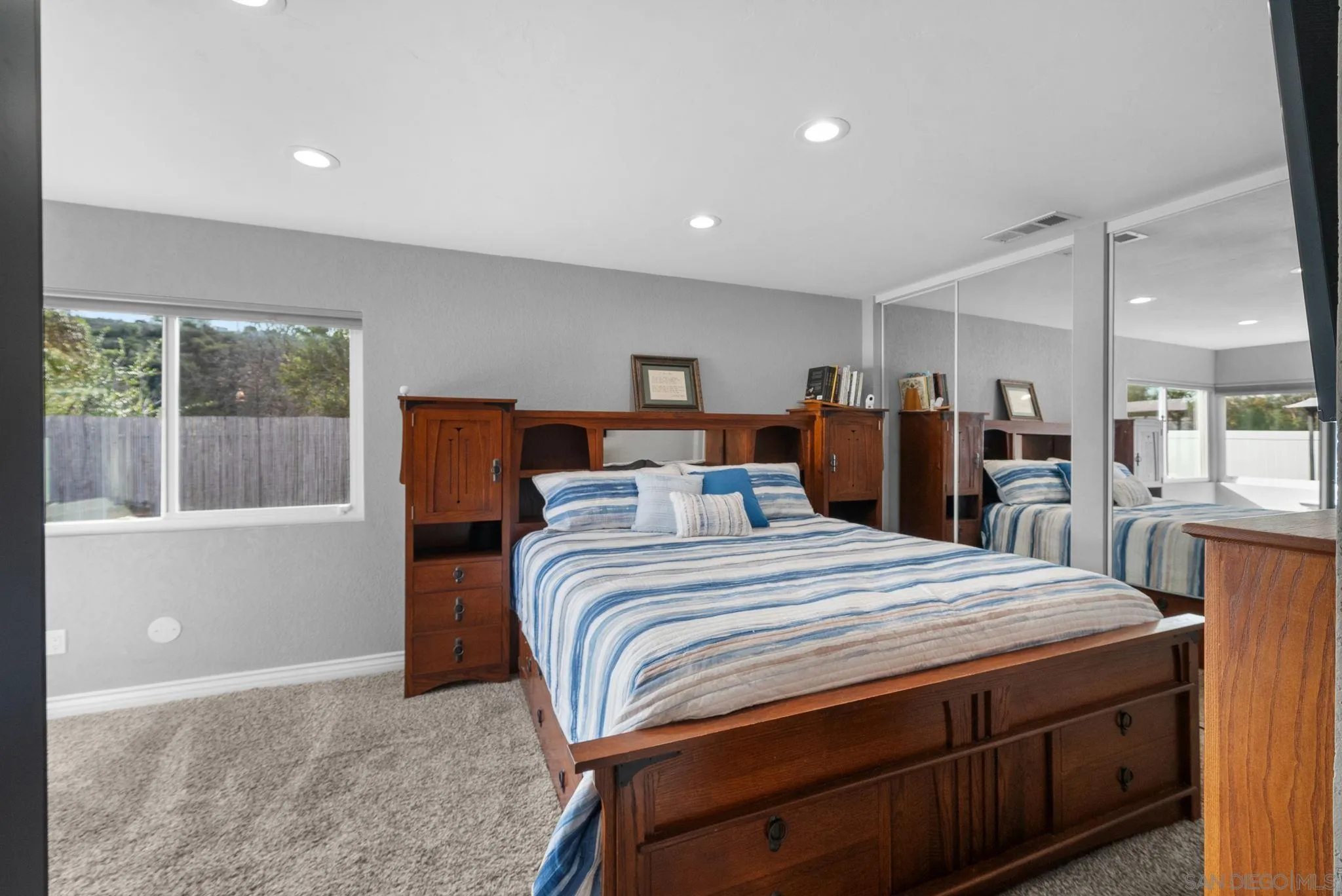 6503 Plaza Ridge Road San Diego, CA 92114 - Photo 19 of 37 a bedroom with a bed and a dresser