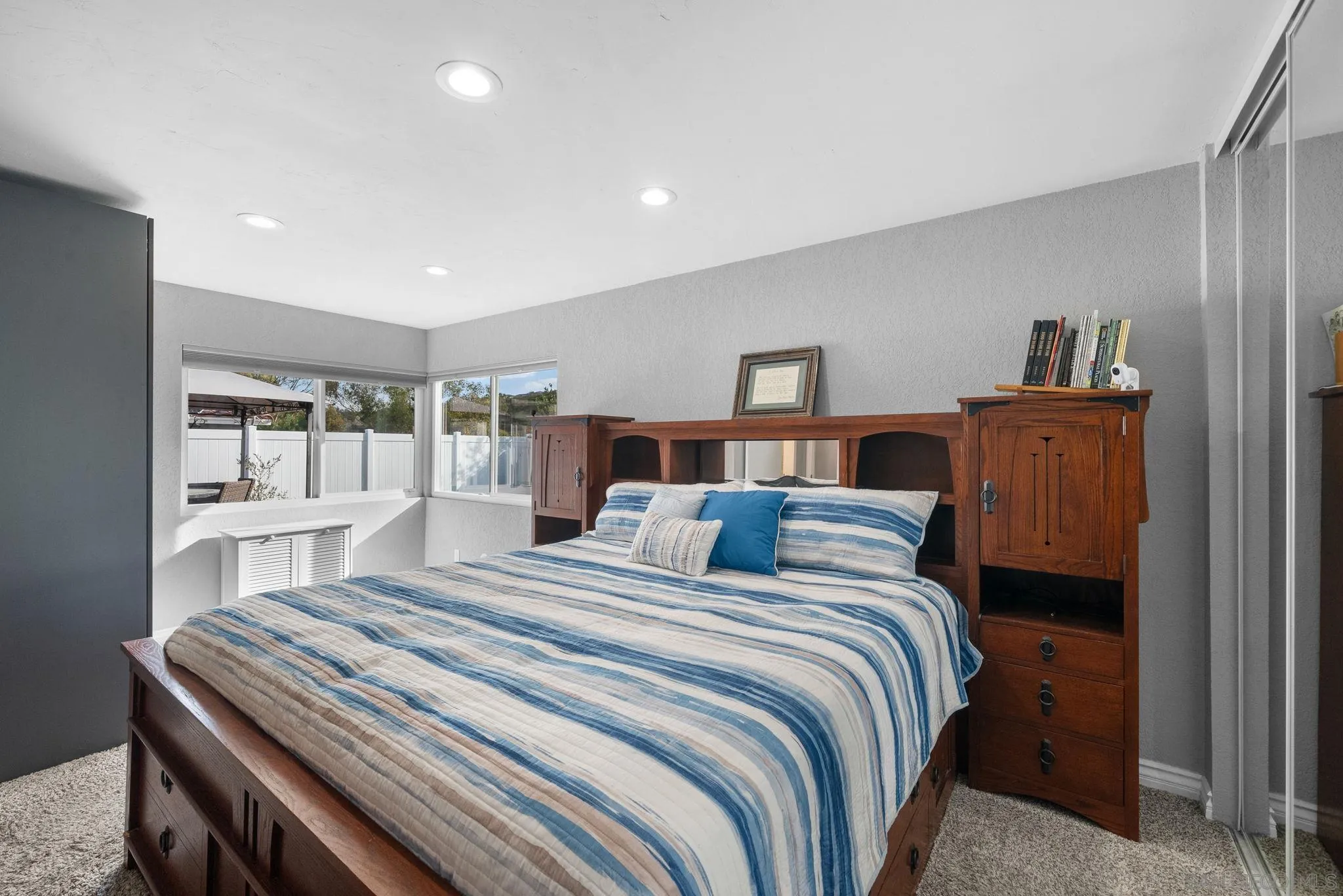 6503 Plaza Ridge Road San Diego, CA 92114 - Photo 20 of 37 a bedroom with a bed and a night stand