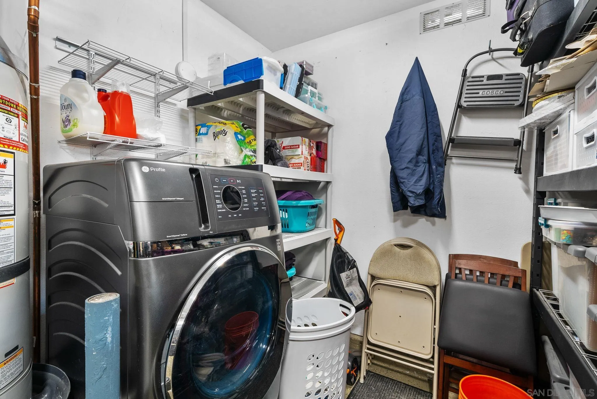 6503 Plaza Ridge Road San Diego, CA 92114 - Photo 22 of 37 a utility room with dryer washer and a flat screen tv