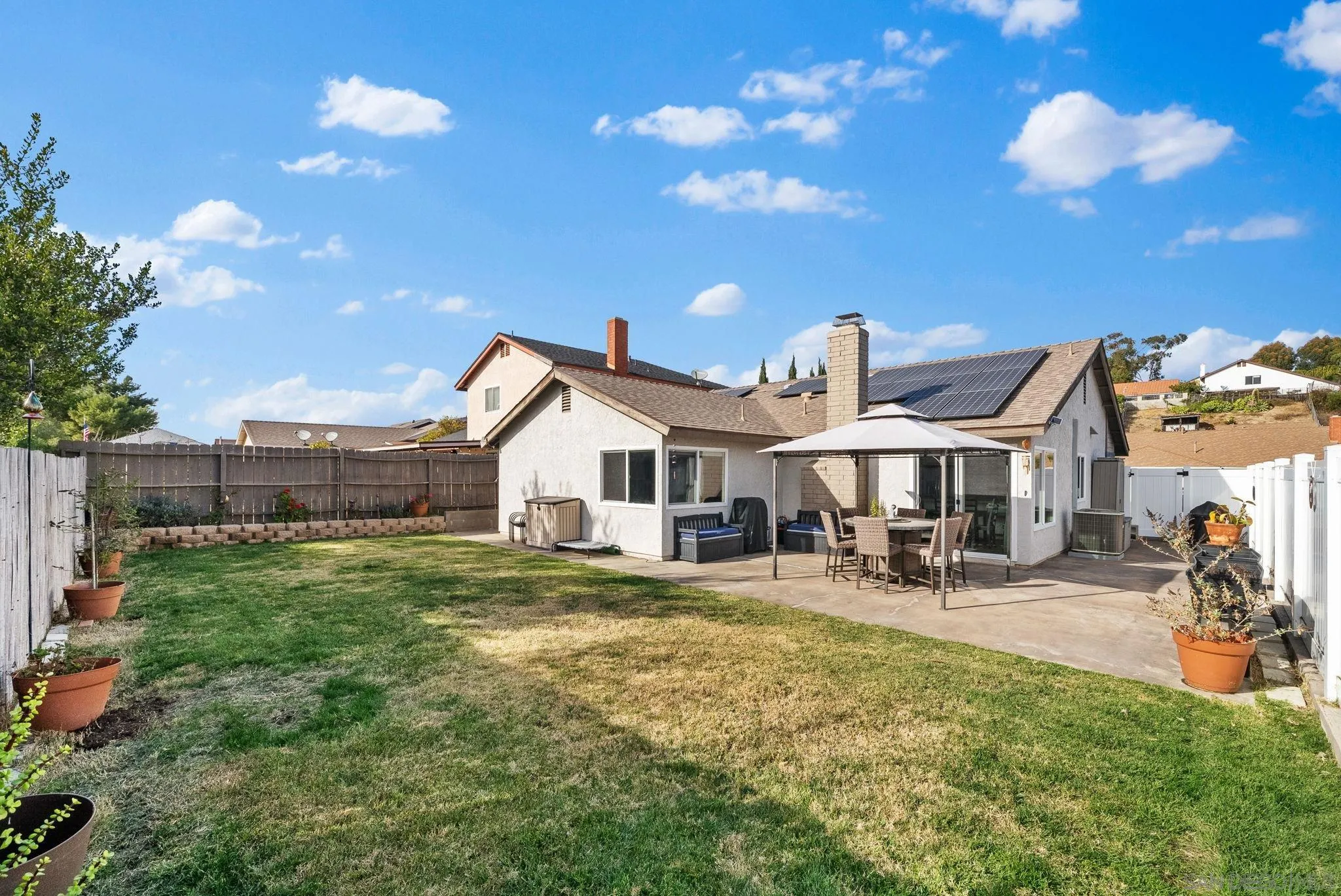 6503 Plaza Ridge Road San Diego, CA 92114 - Photo 28 of 37 a view of a house with backyard and sitting area