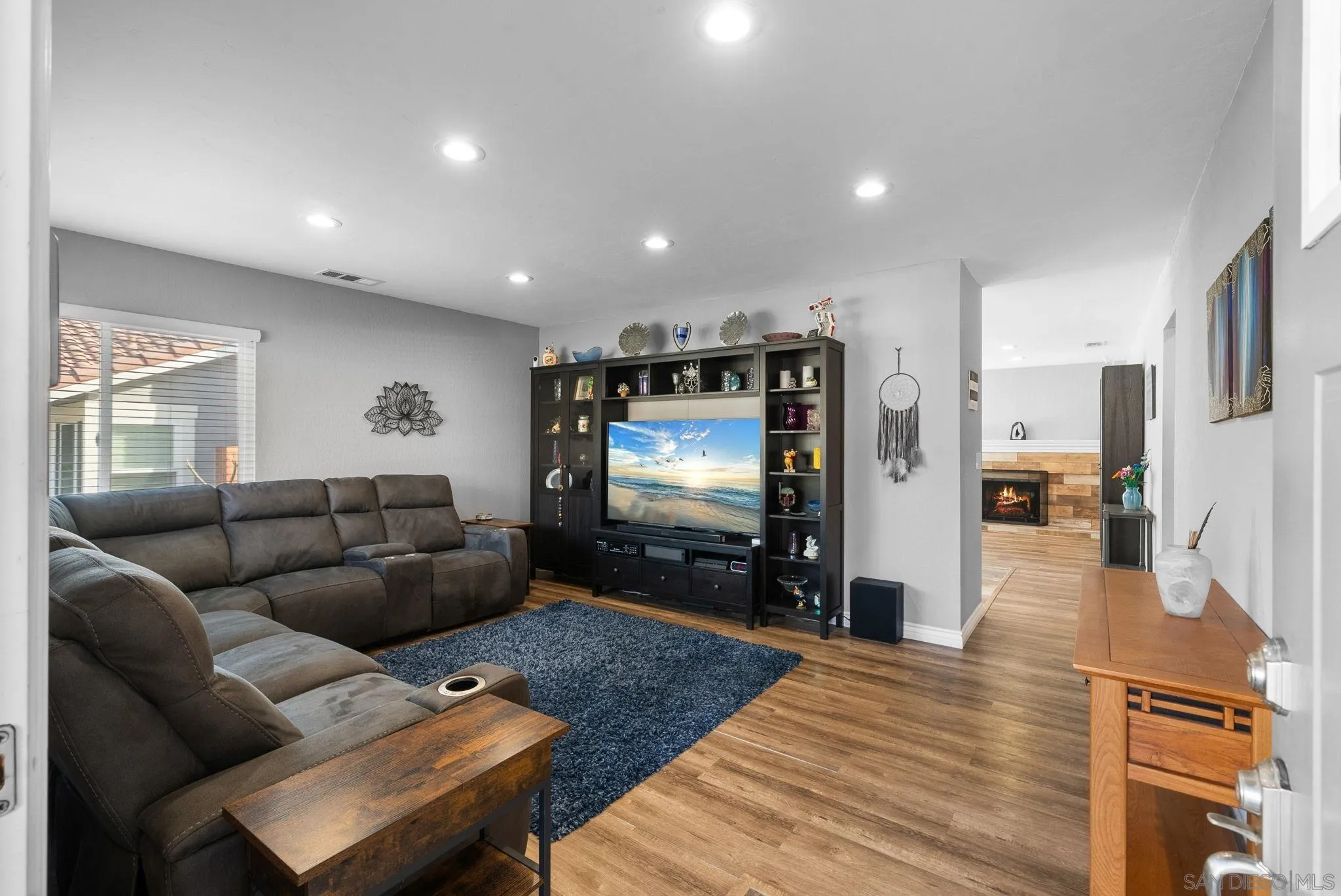 6503 Plaza Ridge Road San Diego, CA 92114 - Photo 4 of 37 a living room with furniture and a flat screen tv