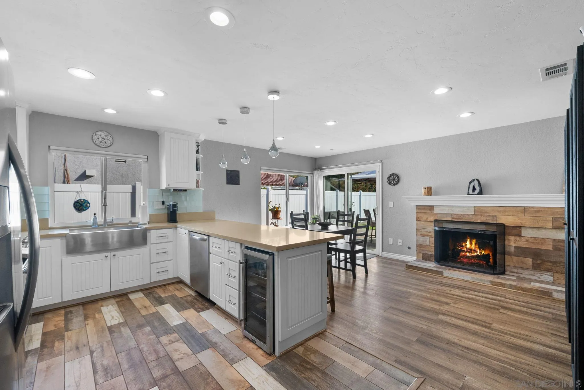 6503 Plaza Ridge Road San Diego, CA 92114 - Photo 6 of 37 a large kitchen with stainless steel appliances granite countertop a stove and a refrigerator