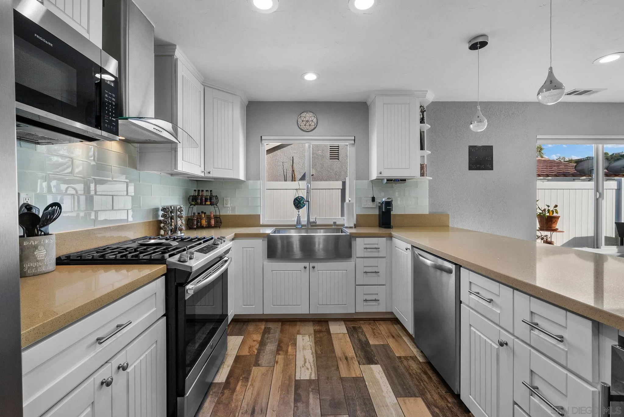 6503 Plaza Ridge Road San Diego, CA 92114 - Photo 9 of 37 a kitchen with a sink cabinets and stainless steel appliances