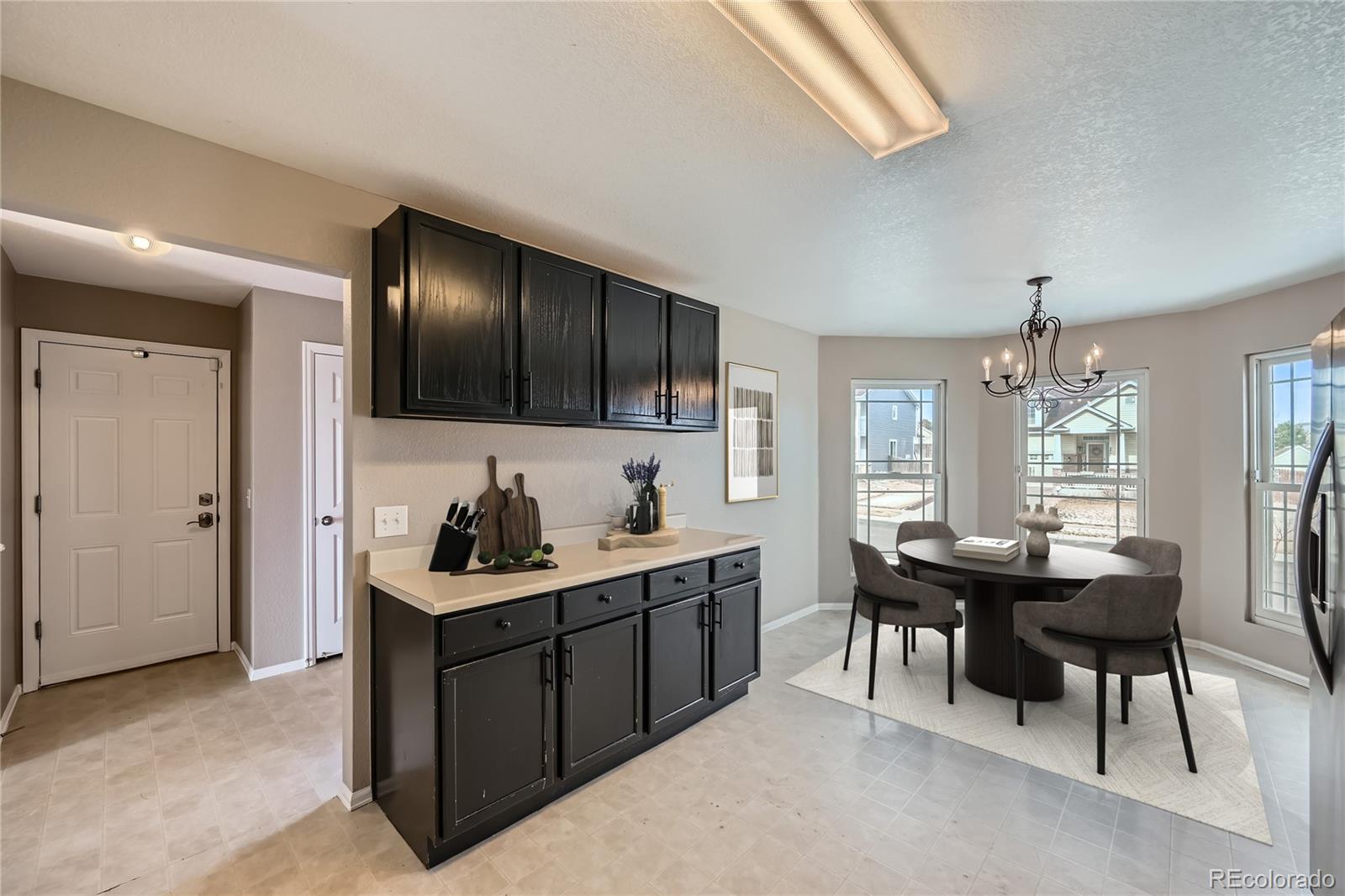 4296 Clover Lane Brighton, CO 80601 - Photo 12 of 35 a kitchen with a sink and cabinets