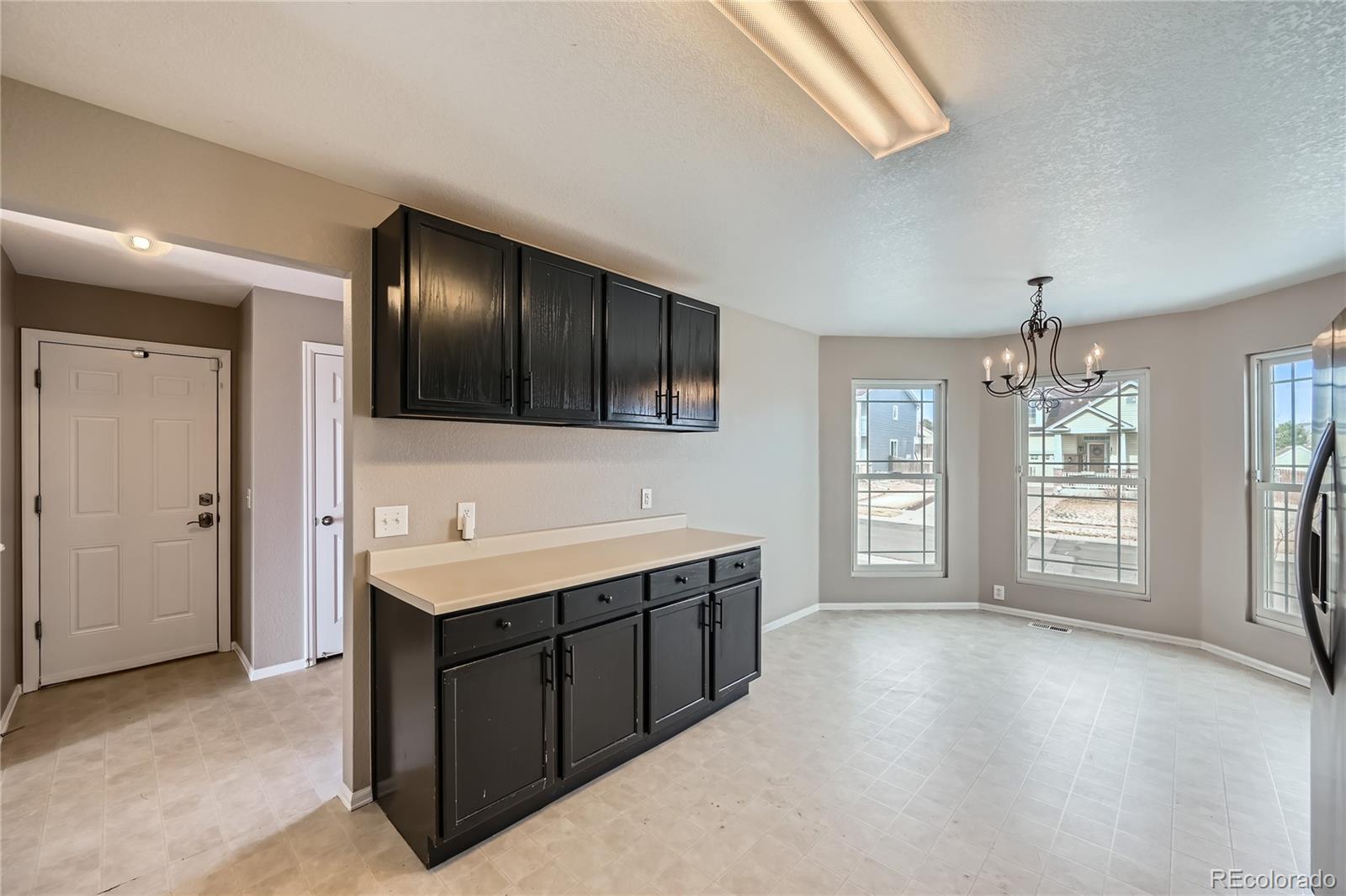 4296 Clover Lane Brighton, CO 80601 - Photo 13 of 35 a bathroom with a sink a large mirror and a bathtub