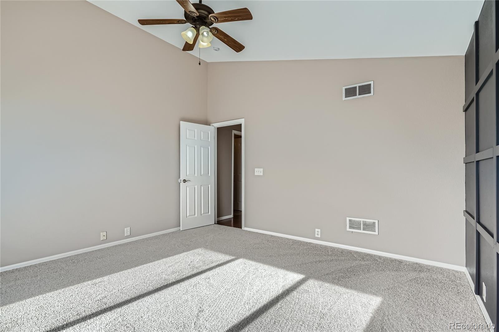 4296 Clover Lane Brighton, CO 80601 - Photo 18 of 35 a view of a room with a ceiling fan