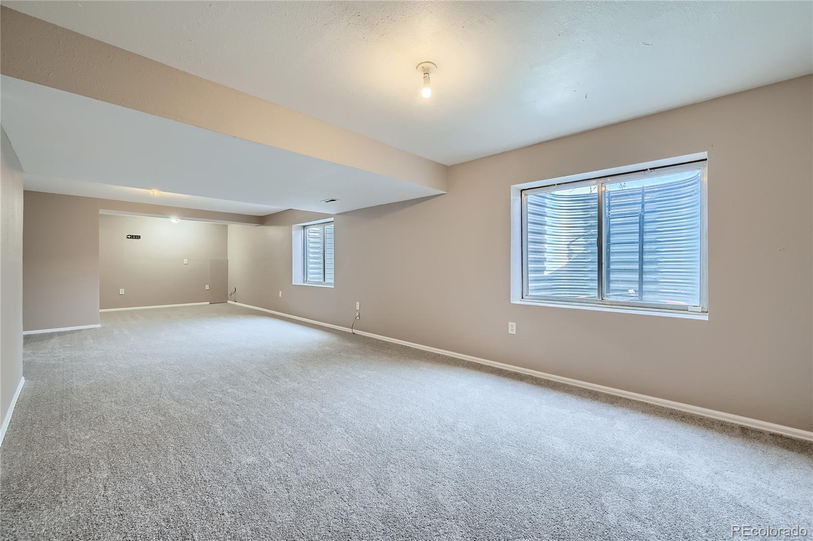 4296 Clover Lane Brighton, CO 80601 - Photo 28 of 35 a view of an empty room with a window