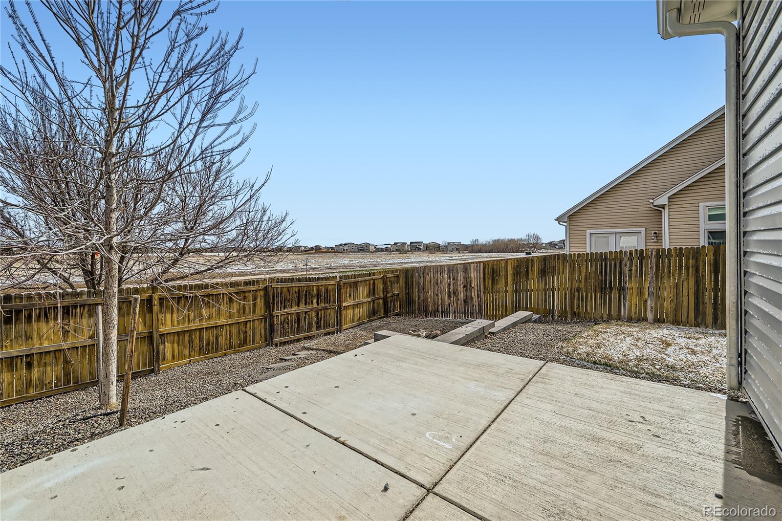 4296 Clover Lane Brighton, CO 80601 - Photo 31 of 35 a view of a house with a backyard