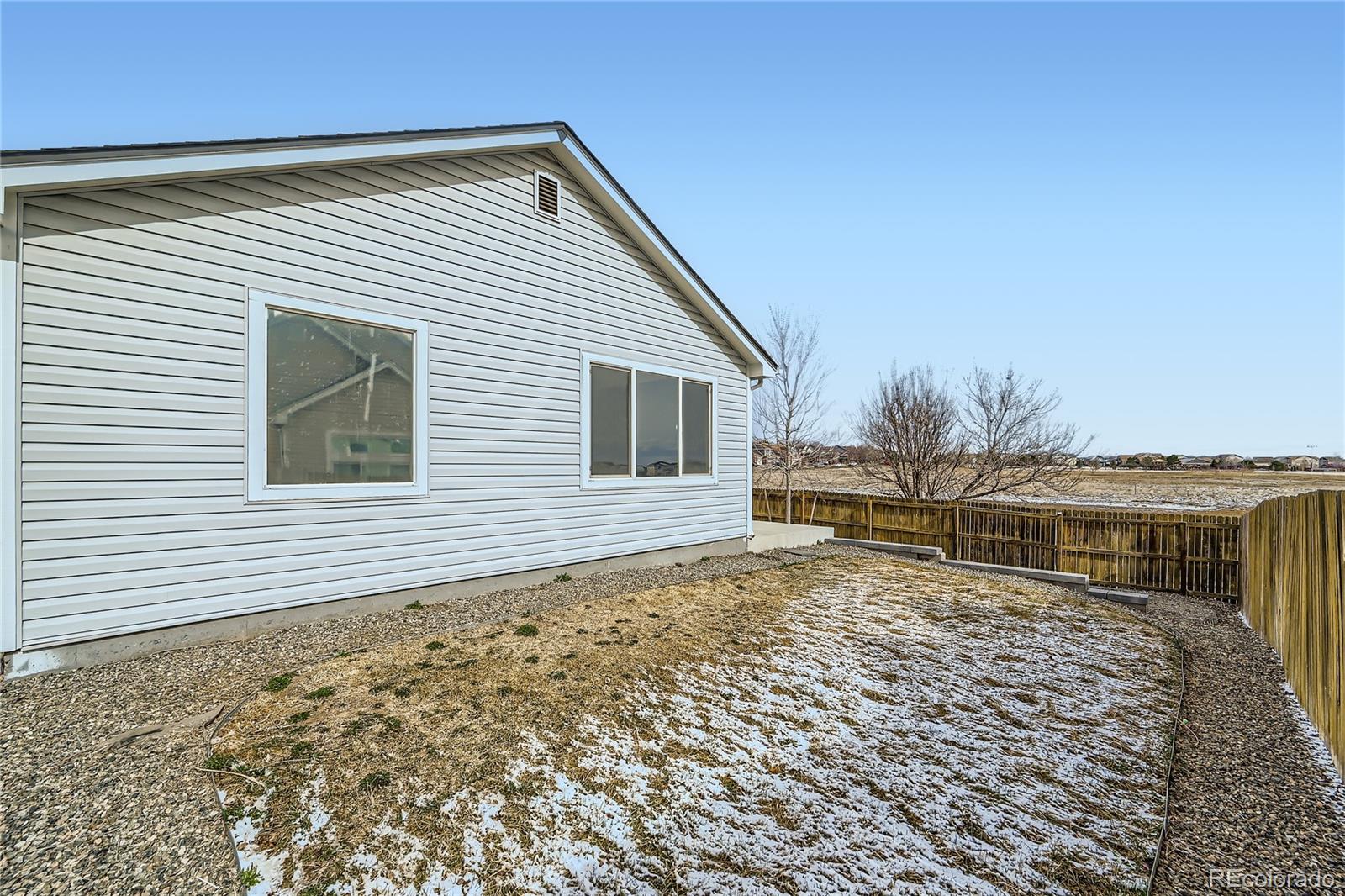 4296 Clover Lane Brighton, CO 80601 - Photo 34 of 35 a house view with a garden space