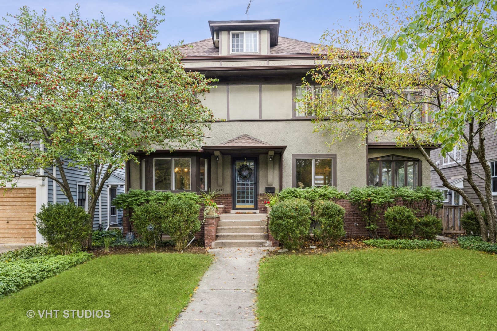 2415 Harrison Street Evanston, IL 60201 - Photo 1 of 42 a front view of a house with garden