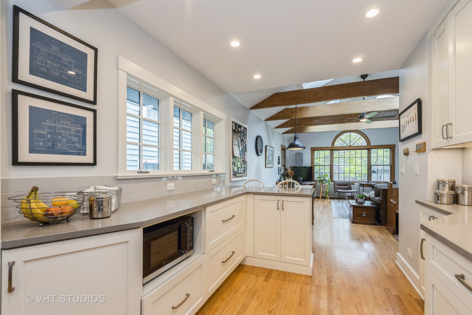 2415 Harrison Street Evanston, IL 60201 - Photo 13 of 42 a kitchen with granite countertop lots of counter top space and wooden floor