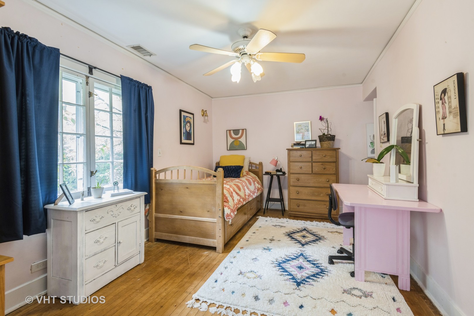 2415 Harrison Street Evanston, IL 60201 - Photo 24 of 42 a bedroom with a bed and wooden floors
