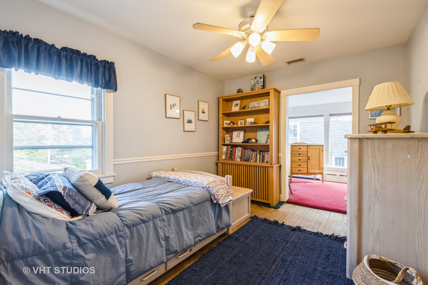 2415 Harrison Street Evanston, IL 60201 - Photo 26 of 42 a bedroom with a bed wooden floor and window