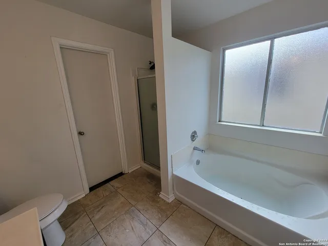 a view of hallway with wooden floor