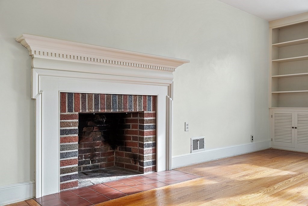 18 Beaver Park Danvers, MA 01923 - Photo 12 of 42 a view of an empty room with wooden floor and a fireplace