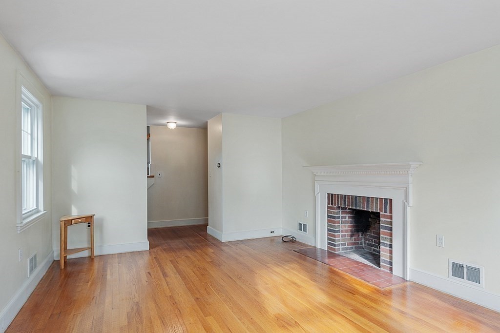 18 Beaver Park Danvers, MA 01923 - Photo 15 of 42 a view of empty room with wooden floor and fireplace
