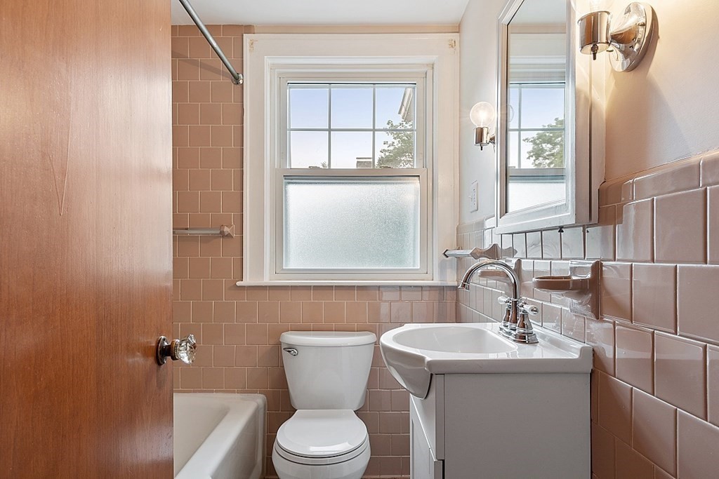 18 Beaver Park Danvers, MA 01923 - Photo 23 of 42 a bathroom with a toilet a sink and mirror