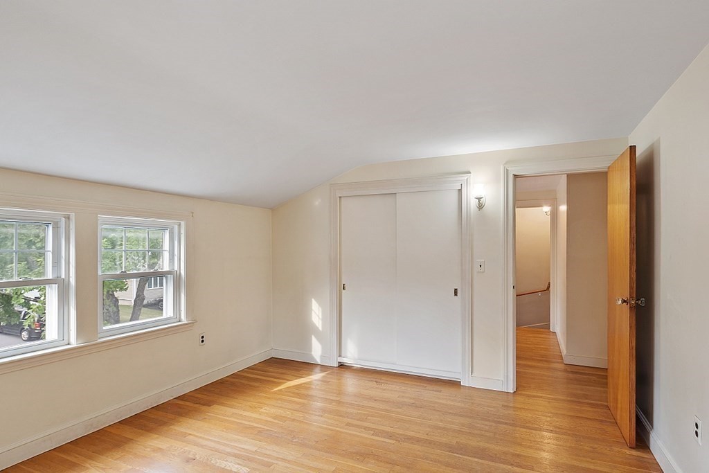 18 Beaver Park Danvers, MA 01923 - Photo 27 of 42 an empty room with wooden floor and windows