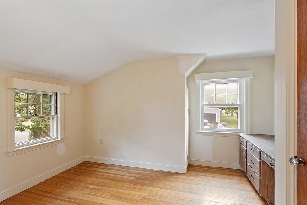 18 Beaver Park Danvers, MA 01923 - Photo 30 of 42 a view of an empty room with wooden floor and a window