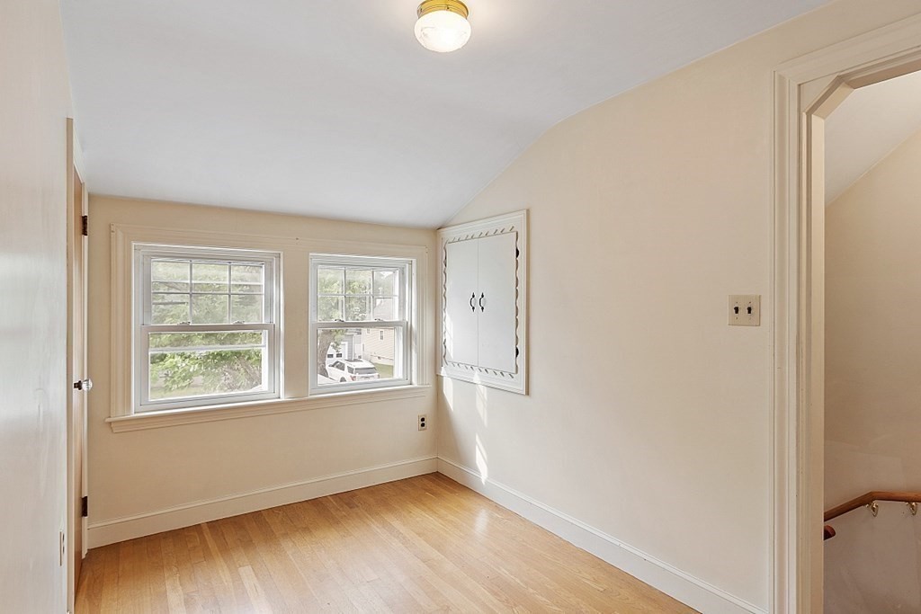 18 Beaver Park Danvers, MA 01923 - Photo 31 of 42 a view of an empty room with wooden floor and a window