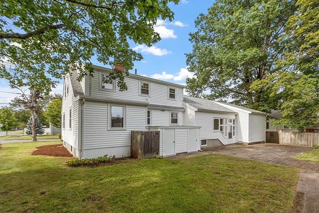 18 Beaver Park Danvers, MA 01923 - Photo 5 of 42 a front view of house with yard and trees in the background
