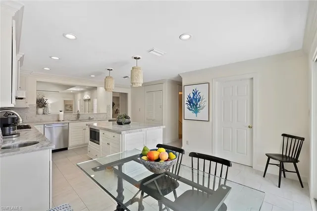 a living room with dining room and wooden floor