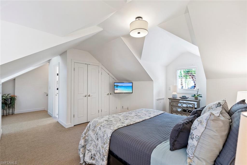 2700 Treasure Lane Naples, FL 34102 - Photo 29 of 44 a bedroom with a bed and a window