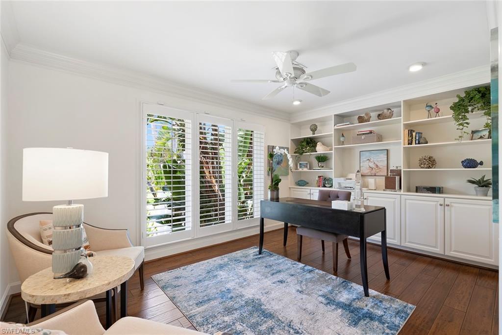 2700 Treasure Lane Naples, FL 34102 - Photo 33 of 44 a living room with furniture and a table