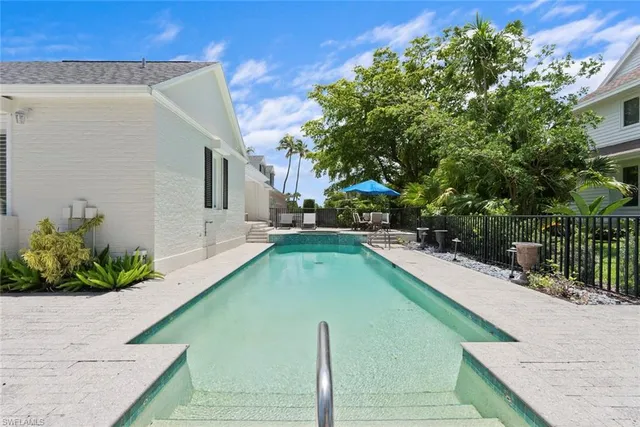 a view of a swimming pool with a patio