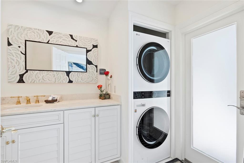2700 Treasure Lane Naples, FL 34102 - Photo 41 of 44 a utility room with dryer and washer
