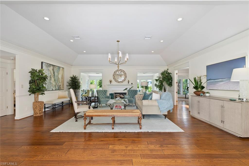 2700 Treasure Lane Naples, FL 34102 - Photo 10 of 44 a living room with furniture or chandelier and a wooden floor