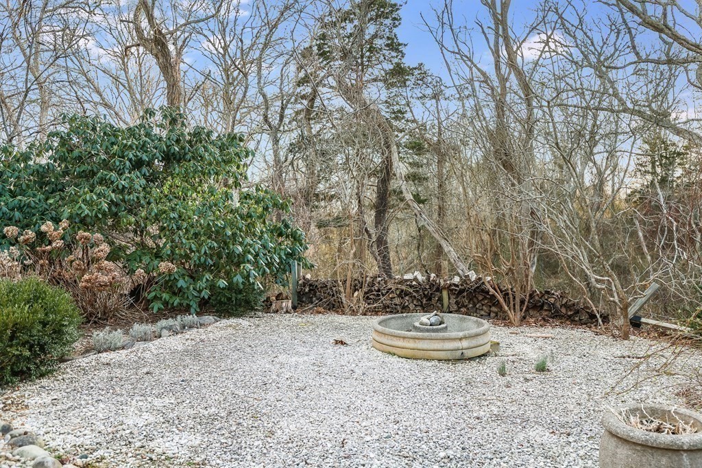 20 Damon Road Falmouth, MA 02540 - Photo 12 of 42 a view of a backyard with table and chairs