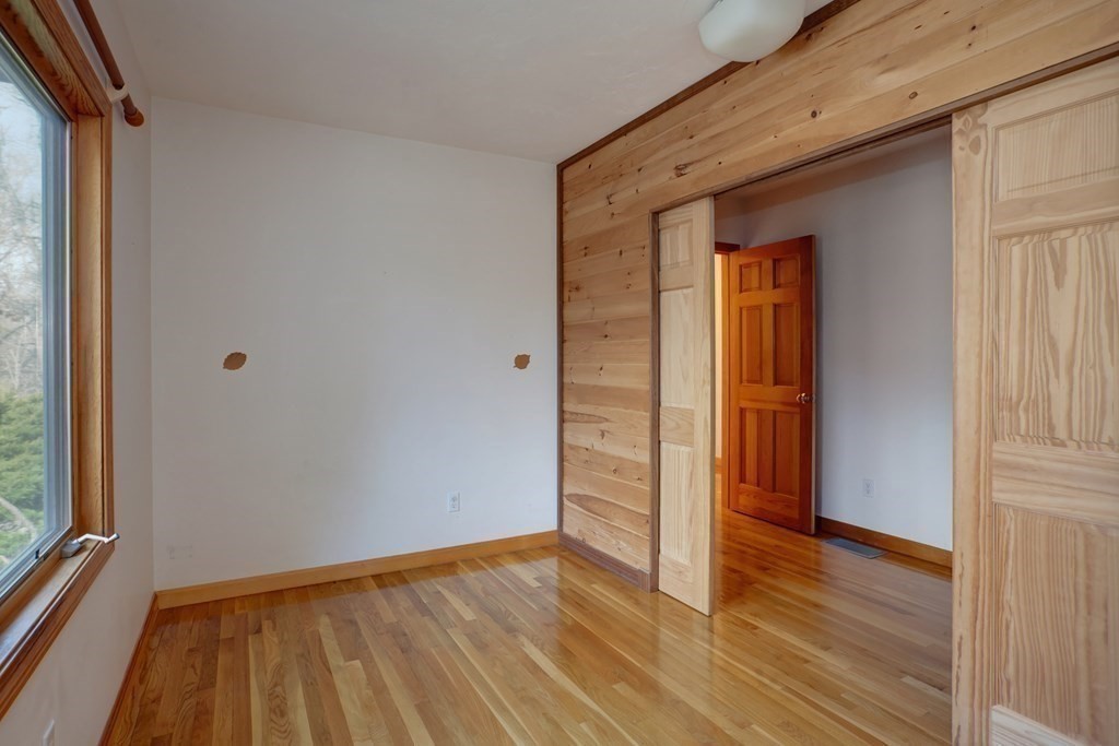 20 Damon Road Falmouth, MA 02540 - Photo 19 of 42 a view of an empty room with wooden floor and a window