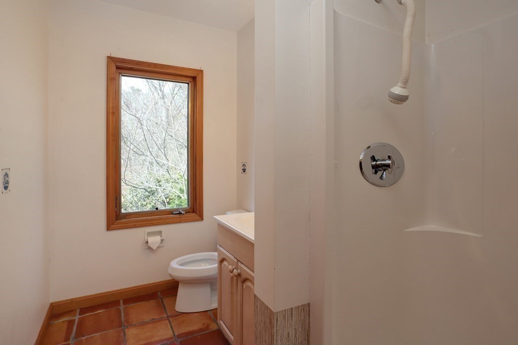 20 Damon Road Falmouth, MA 02540 - Photo 20 of 42 a bathroom with a toilet a sink and a window