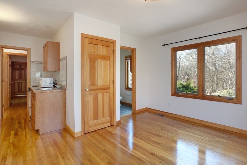 20 Damon Road Falmouth, MA 02540 - Photo 21 of 42 a view of empty room with wooden floor and windows