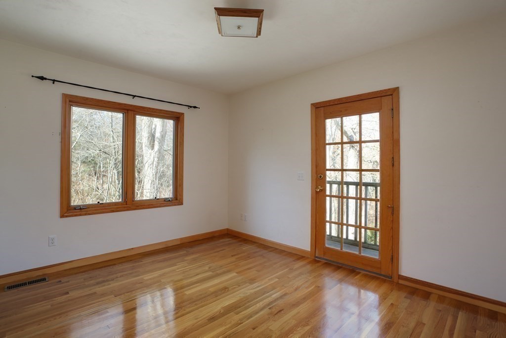 20 Damon Road Falmouth, MA 02540 - Photo 22 of 42 an empty room with wooden floor and windows
