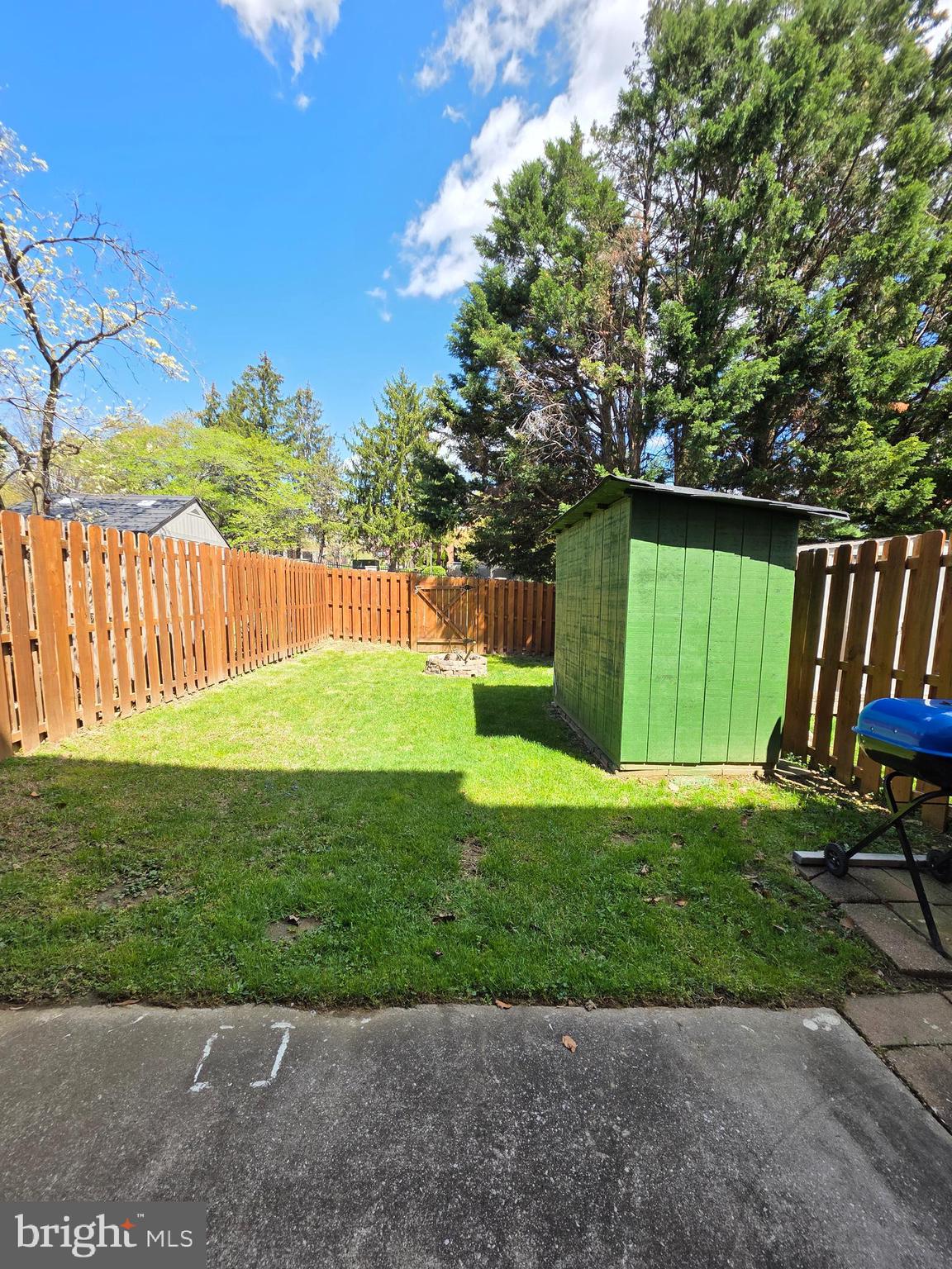 10 Casey Court Baltimore, MD 21228 - Photo 12 of 28 a view of a backyard with a garden and trees
