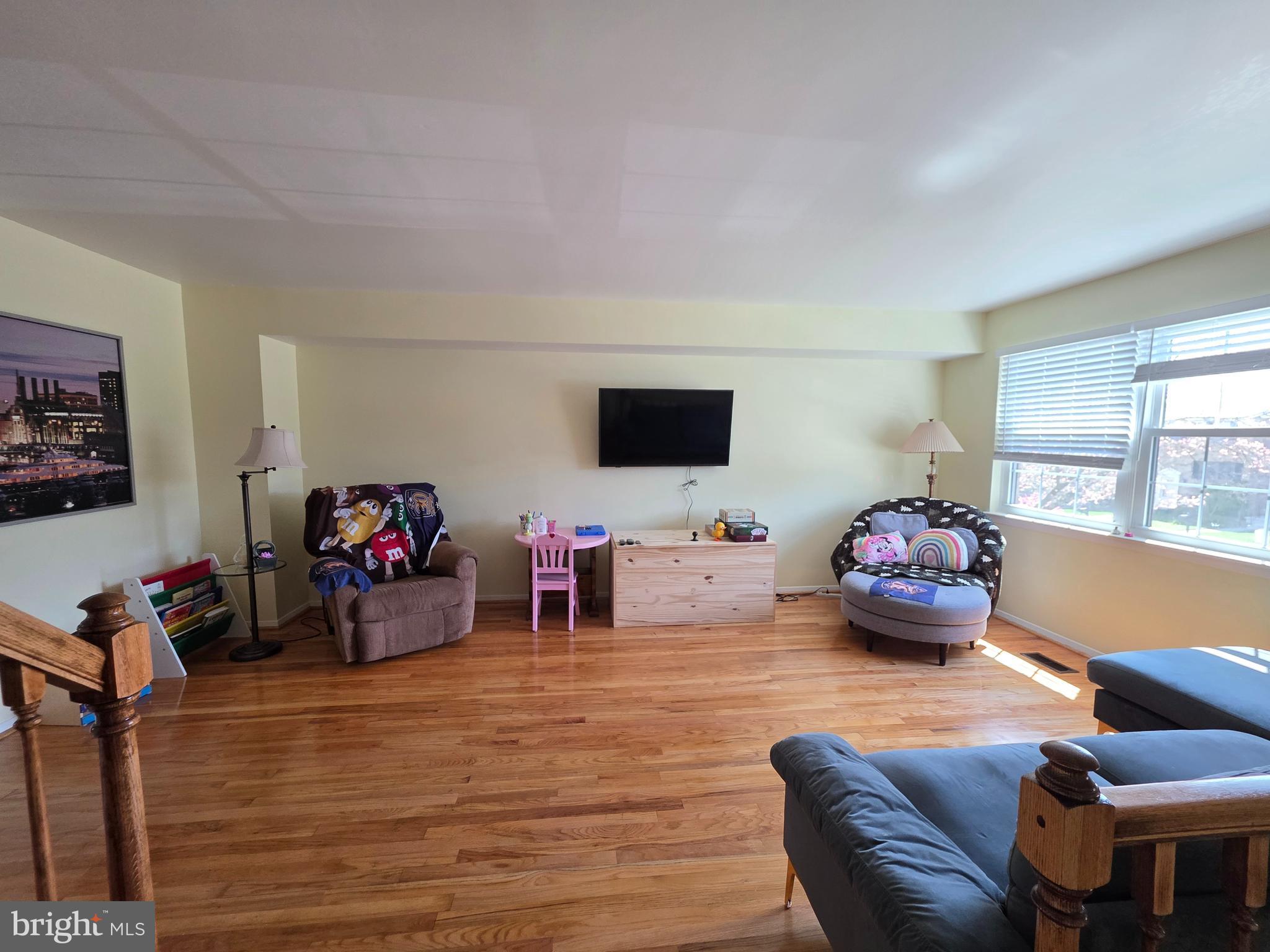 10 Casey Court Baltimore, MD 21228 - Photo 13 of 28 a living room with furniture and a flat screen tv