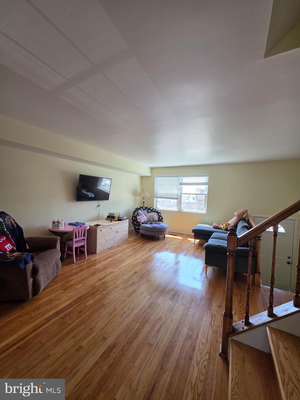 10 Casey Court Baltimore, MD 21228 - Photo 14 of 28 a living room with furniture and a wooden floor